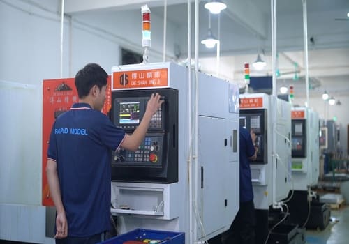 CNC Operator Operating the Control Panel